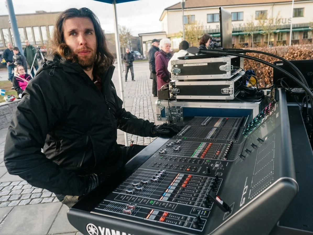 Philip at an outdoor mixing console during earlier sound-production work.